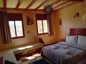 Postel nebo postele na pokoji v ubytování hotel arganier tafraoute