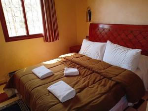 Postel nebo postele na pokoji v ubytování hotel arganier tafraoute