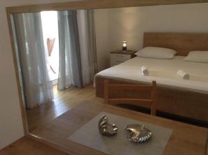 Postel nebo postele na pokoji v ubytování Apartments Leut