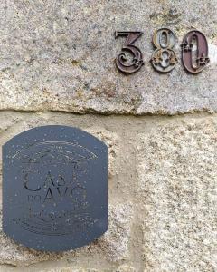 a sign on the side of a stone wall at Casa do Avô in Cinfães +14 photos