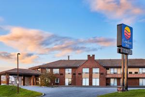 a building with a sign in front of it at Comfort Inn in Rouyn-Noranda