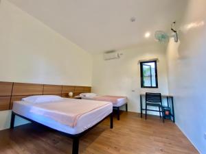 Casa de Moalboal客房内的一张或多张床位