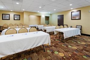 a conference room with white tables and chairs at Holiday Inn Express Benicia by IHG in Benicia