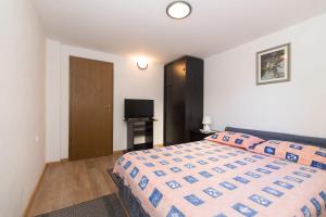 Postel nebo postele na pokoji v ubytování Apartments Jaksa