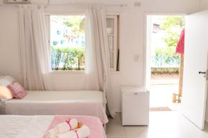 Кровать или кровати в номере Canto das Laranjeiras Villa