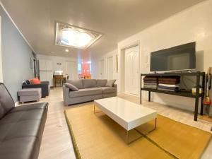 a living room with a couch and a table at Kang's Apartments in Central Seoul in Seoul