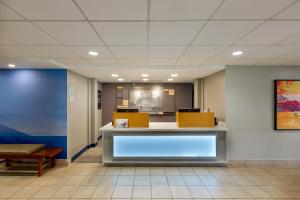an empty lobby of a hospital with a reception desk at Holiday Inn Express San Jose Costa Rica Airport by IHG in Alajuela City