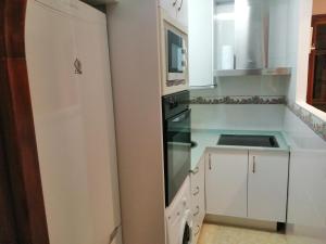 Kuchyň nebo kuchyňský kout v ubytování Apartamento Luz