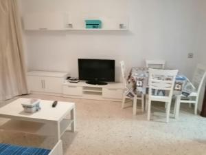 TV a/nebo společenská místnost v ubytování Apartamento Luz