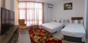 Ein Bett oder Betten in einem Zimmer der Unterkunft Coconut Bay Lodge