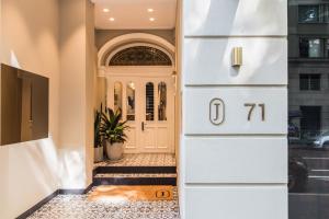 a front door of a house with the number at The Jensen Potts Point in Sydney