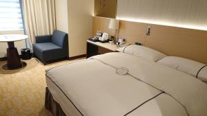Postel nebo postele na pokoji v ubytování K Hotel Tianjin