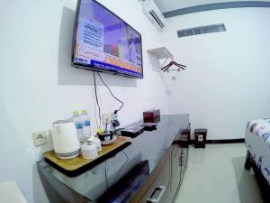 TV o dispositivi per l'intrattenimento presso Amaryllis Guesthouse Syariah