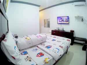 Letto o letti in una camera di Amaryllis Guesthouse Syariah
