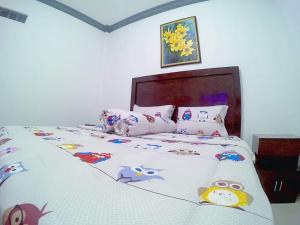 Letto o letti in una camera di Amaryllis Guesthouse Syariah