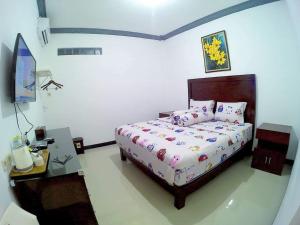 Letto o letti in una camera di Amaryllis Guesthouse Syariah