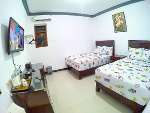 Letto o letti in una camera di Amaryllis Guesthouse Syariah