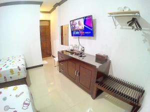 TV o dispositivi per l'intrattenimento presso Amaryllis Guesthouse Syariah