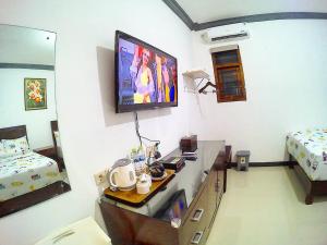 TV o dispositivi per l'intrattenimento presso Amaryllis Guesthouse Syariah