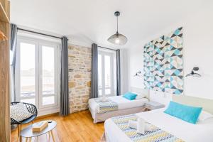 Un ou plusieurs lits dans un hébergement de l'établissement Hotel Cote Basque