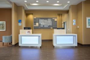 a lobby of a hospital with two blank screens at Holiday Inn Express - Springfield Downtown, an IHG Hotel in Springfield