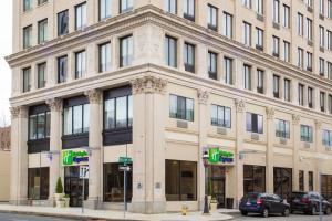 a large building on the corner of a street at Holiday Inn Express - Springfield Downtown, an IHG Hotel in Springfield