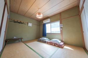 Ένα ή περισσότερα κρεβάτια σε δωμάτιο στο Nagasaki Kagamiya