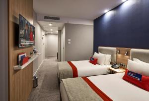 Postel nebo postele na pokoji v ubytování Holiday Inn Express - Istanbul - Atakoy Metro by IHG