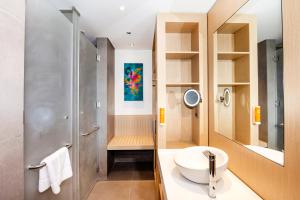 a bathroom with a sink and a shower at Premier Inn Dubai Dragon Mart in Dubai