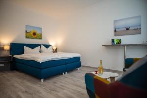 Postel nebo postele na pokoji v ubytování Hotel Hanseat Stralsund
