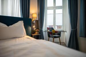 Postel nebo postele na pokoji v ubytování Hotel Hanseat Stralsund
