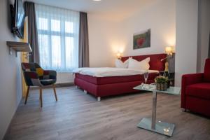 Postel nebo postele na pokoji v ubytování Hotel Hanseat Stralsund