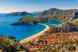 a scenic view of a beach with a large body of water at Minu Hotel in Fethiye