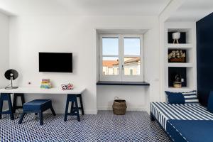 A television and/or entertainment centre at Maison Il Conservatorio