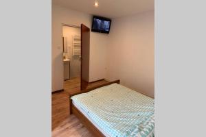 Posteľ alebo postele v izbe v ubytovaní Apartamencik Centrum