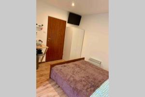 Posteľ alebo postele v izbe v ubytovaní Apartamencik Centrum