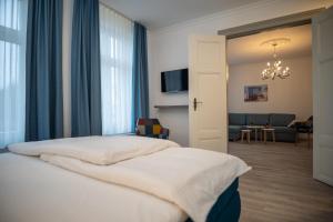 Postel nebo postele na pokoji v ubytování Hotel Hanseat Stralsund