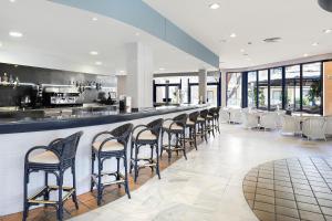 a large kitchen with a lot of counter space at Sol Sancti Petri Aparthotel in Chiclana de la Frontera