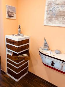 a bathroom with a boat on the wall at Goitzsche Resort in Bitterfeld