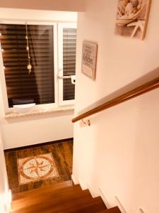 a room with a door and a window and a wooden floor at Goitzsche Resort in Bitterfeld