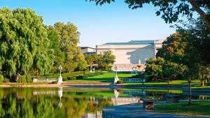 a park with a pond in front of a building at InterContinental Suites Hotel Cleveland, an IHG Hotel in Cleveland