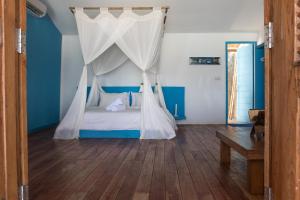 Lova arba lovos apgyvendinimo įstaigoje La Kabane