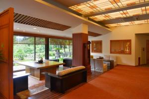 a living room with a couch and a table at Nikko Hoshino Yado in Nikko +119 photos