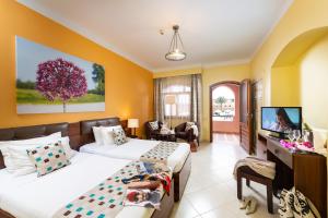 Ein Bett oder Betten in einem Zimmer der Unterkunft Three Corners Rihana Resort El Gouna