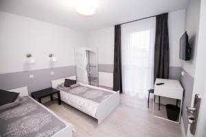 Posteľ alebo postele v izbe v ubytovaní White Home Room