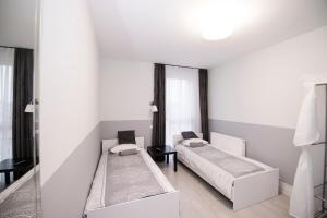 Posteľ alebo postele v izbe v ubytovaní White Home Room