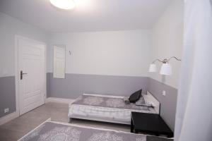 Posteľ alebo postele v izbe v ubytovaní White Home Room
