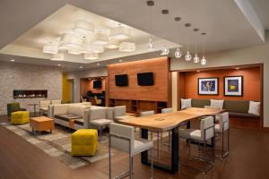 a dining room with a table and chairs at Holiday Inn Portland-Airport I-205, an IHG Hotel in Portland