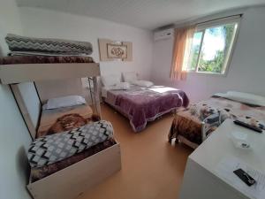 Ένα ή περισσότερα κρεβάτια σε δωμάτιο στο Pousada Vila nova +6 φωτογραφίες
