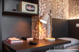 TV a/nebo společenská místnost v ubytování Hotel Astoria
